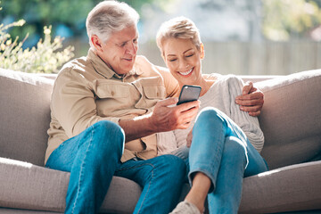 Smile, senior couple and sofa with phone for browsing social media, streaming video and reading online news. Happy elderly woman and man with mobile of communication, article or hug together at house