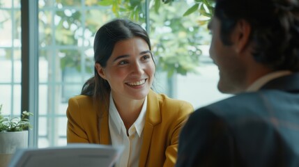 Two people engaged in office conversation.