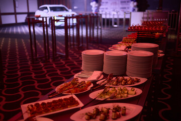 Buffet table with appetizers and finger foods, creating an elegant dining experience