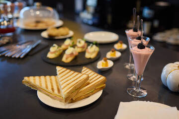 Enjoy an Elegant Brunch featuring a delectable assortment of Sandwiches and Desserts