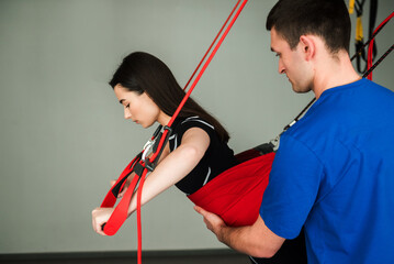 Activating neuromuscular system with red cord equipment. Supervised red cord physiotherapy at...