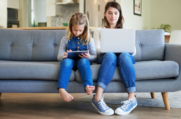 Laptop, tablet and mother with girl child in home for streaming movies, film or series together on...