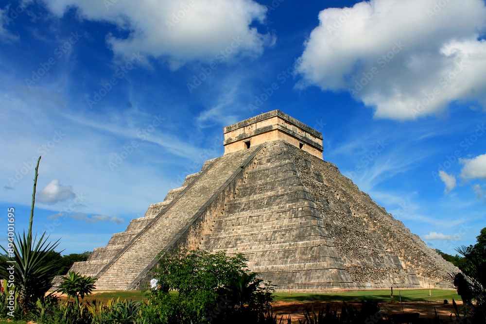 Wall mural history in stone: contemplate the greatness of the mayan civilization on the façade of chichén itzá,