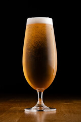 Glass of Lager Beer on a black background