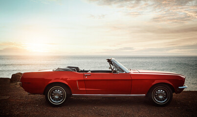 Convertible, car and sunset at beach for travel with road trip, adventure and journey with mockup...