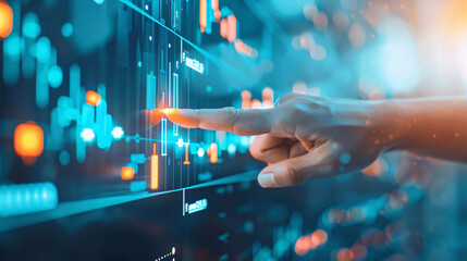 A hand is pointing at a screen with a lot of numbers and lines. Concept of focus and concentration as the person points to a specific area on the screen