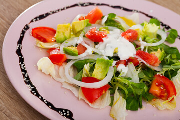 Image of deliciously salad of avocado, grapefruit, tomatoes and corn salad