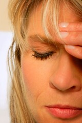 A Woman With Her Hand On Her Head