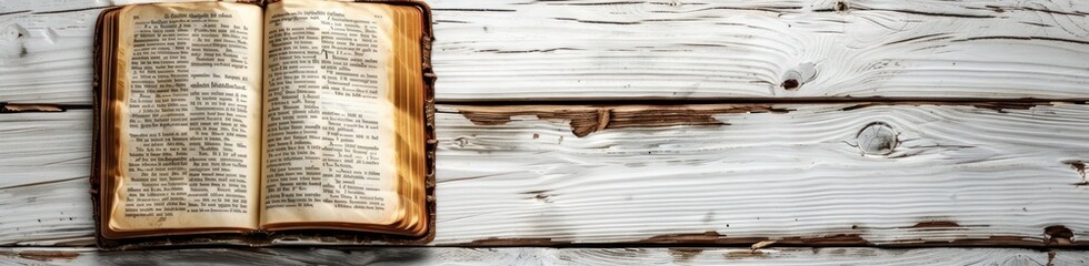 Open Book on a Weathered Wooden Surface