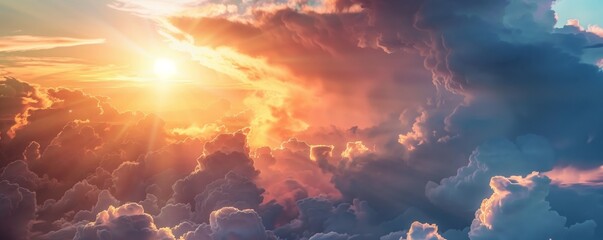 A beautiful panoramic view of the clouds in the sky at sunset. Dramatic clouds in the sky in surreal and exuberant view.