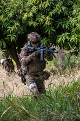 Airsoft Paintball,Shooting Airsoft Guns,Tactical Equipment Action, War Game, Combat, Extreme Sport, Military Strategy, Military Uniform, Battlefield, Outdoor, Team