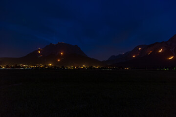 Traditional mountain bonfires for the summer solstice in the Tiroler Zugspitz Arena near Ehrwald