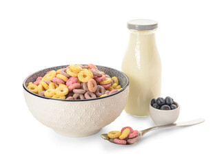 Bowl with colorful sweet cereal rings, bottle of milk and blueberries on white background