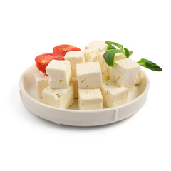 Plate with tasty cut feta cheese, tomatoes and salad leaves on white background