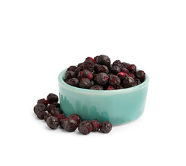 Bowl with tasty freeze-dried black currant on white background