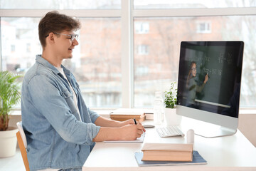 Male student studying Math online at home