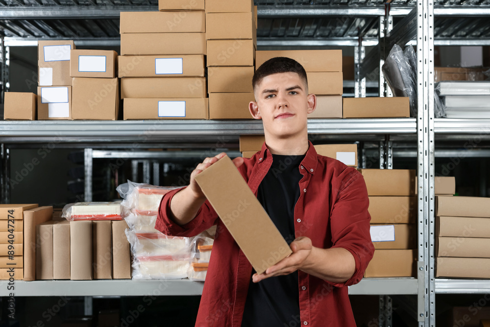 Sticker young man with cardboard boxes in auto store