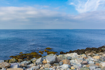 Serene seascape with calm waters, beautiful sky and rocky shoreline, Rockport, Massachusetts, USA