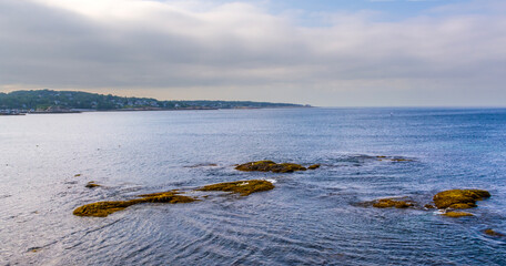 Beautiful Rockport coastline with calm waters and outcrops, Massachusetts, USA