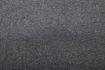 Black car mat as background, closeup view