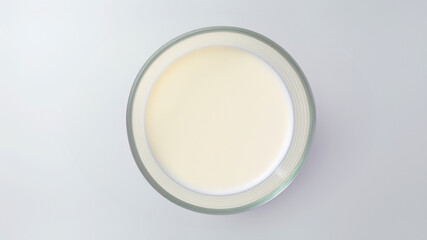 Bowl of creamy milk on a white background, a wholesome and nutritious dairy beverage