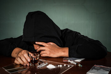 Alcohol drink in glass, syringe with drug dose, narcotic powder, Concept of addiction and bad habits