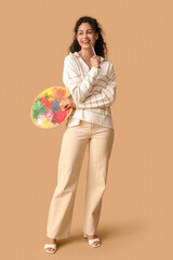 Female African-American artist on beige background