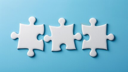 Three blank white puzzle pieces on blue backdrop