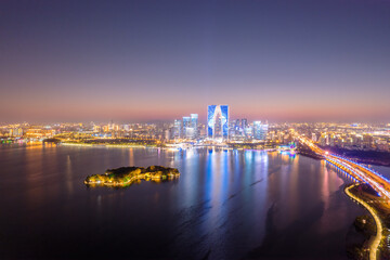 Stunning Aerial View of Urban Skyline at Dusk Over Water
