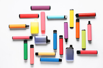 Different electronic cigarettes on white background