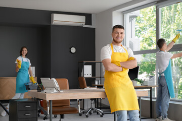 Portrait of male janitor in office