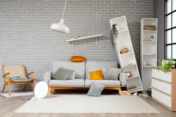 Interior of messy living room with overturned furniture after earthquake