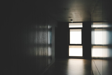 A beautiful window with soft light. Abandoned hallway with light at the end shining