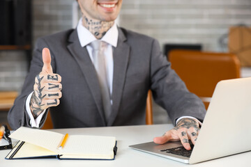 Young businessman using virtual screen at table in office, closeup