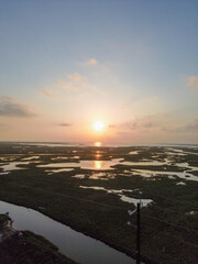 The sun rises along Beach Road and the Matagorda Bay the day after Hurricane Beryl brought deadly...