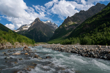 View of the Dombay-Ulgen gorge in the mountains of the North Caucasus near the village of Dombay on...