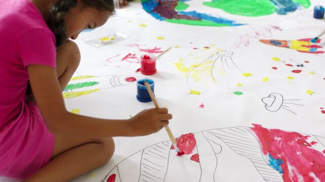 Painting, drawing and art for school children on a canvas during elementary lesson for a project. Diverse kids being creative and having fun while learning about the globe and being creative