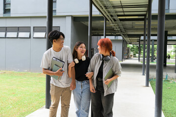 Group of Happy Students Walking Together on Campus, Engaging in Conversation and Enjoying University Life