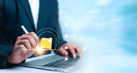 Businessman working on laptop computer documents, managing, files, data, folders, share, digital,...