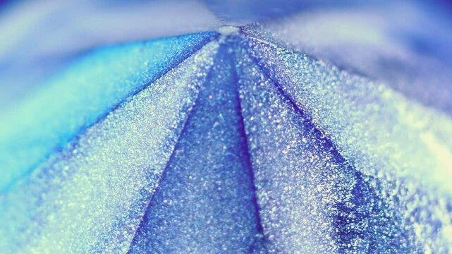 Sparkling shape. Glitter paint. Defocused glowing multicolored jewel crystal luminous shimmer particles ink reflected texture abstract art background.