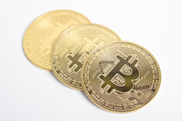 Bitcoin isolated on white background. Cryptocurrency. Group of Golden bitcoin physical gold coin. Symbol of the crypto currency