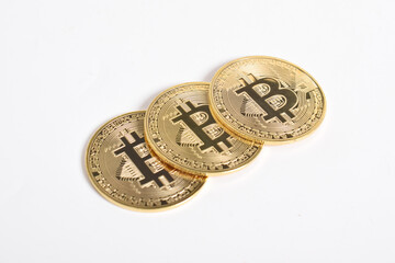 Bitcoin isolated on white background. Cryptocurrency. Group of Golden bitcoin physical gold coin. Symbol of the crypto currency