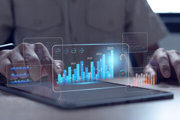 Businessman analyzes virtual profits, predicts company business growth in 2025, annual financial...