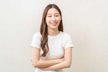 Obraz premium Smile positive, happy asian young woman, girl in casual, portrait of beautiful female with long hair feeling prond standing looking at camera, isolated on white background, copy space.