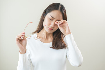 Eye problem concept, fatigue asian young woman tired eyes irritated rubbing, massage eye dry relief...