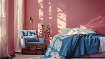 Armchair and pink wall in large bedroom with blue blanket on bed near wooden lamp