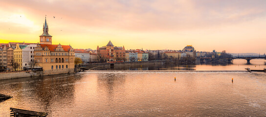 View of the city of Prague and the Vltava river with Old Town Bridge Tower on  Charles bridge  in Prague, Czech Republic.