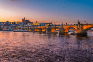View of the city of Prague castle in hradcany and the Vltava river with Charles bridge in Prague, Czech Republic.