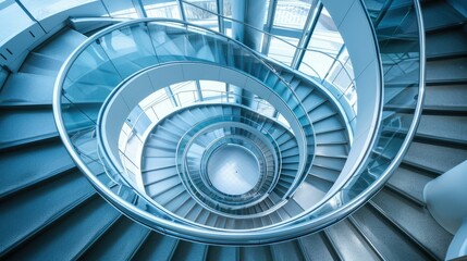 Fototapeta premium Spiral staircase inside a modern cylindrical building with glass floors