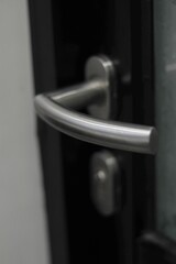 close up of modern door handle with lock. 